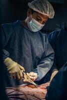 Latin doctor in surgery in operating room photo