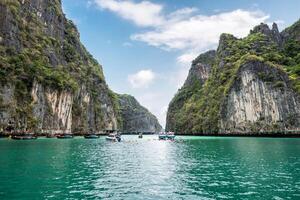 Pileh lagoon limestone mountain surrounded and emerald sea with tourists traveling at Krabi photo