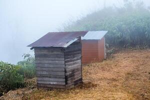 Old decay wooden public toilet photo