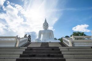 White big buddha statue bright in wat tha khanun temple photo