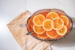 Cocktail juice recipe with orange slices on scott napery photo