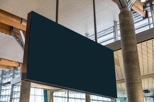 Blank billboard flight information hanging in the airport photo