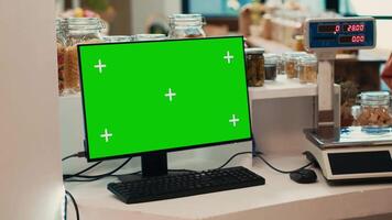 Greenscreen display at local grocery store checkout, client looking for freshly harvested fruits and vegetables. PC showing isolated mockup template, promoting low carbon footprint. video
