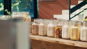 Bulk products in reusable jars on display at local supermarket to protect environmental changes. Eco friendly zero waste eco store with homegrown additives free pasta, spices and sauces. video