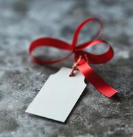 AI generated white tag with red ribbon hanging on grey photo