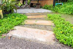 Stone curved walkway in garden photo