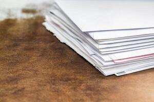 Documents and envelopes on office table photo