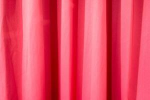 Red curtain crumpled texture background photo