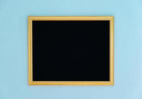 Gold frame tracery blank decor on wall photo