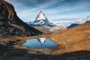 Riffelsee lake and Matterhorn mountain reflection at Switzerland photo