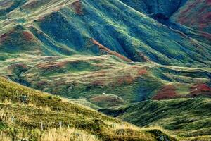 Landscape of rugged texture rocky mountain and herd of cow on pasture at rural scene photo