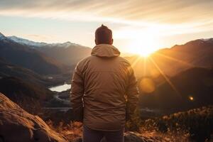 AI generated a man looking at the sun in the mountains view from the back photo