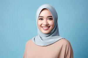 AI generated Asian muslim woman isolated blue background photo