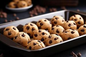 AI generated Baking pan with raw chocolate chip cookie balls on table, closeup photo