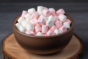 AI generated Marshmallows on wooden bowl, gray background photo