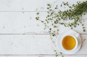 AI generated tea cup with a cup of thyme on a white wood table photo