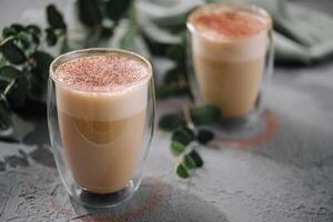 Hot coffee with milk in glass cup photo