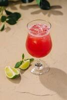 Cold summer strawberry cocktail with lime photo