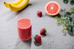 Fresh grapefruit juice in a glass photo