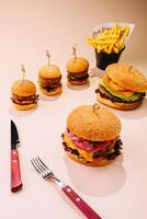 large and mini burgers with fries photo