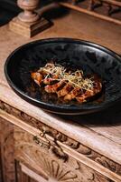 Roast duck chinese cuisine sliced on plate photo