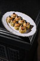 Warm sushi rolls with tempura cream cheese photo