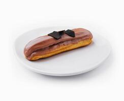 Eclair topped with chocolate on white plate photo