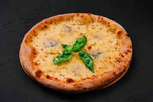 fresh tasty four cheeses pizza on wood photo