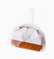 Sweet bread in plastic packaging on a white background photo