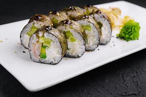 sushi maki with shrimp and cucumbers photo