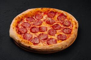 Pizza with pepperoni and parmesan photo