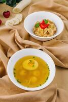 hot soup with meatballs and oatmeal with banana photo