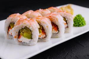 Sushi roll with snow crab and tobiko caviar photo