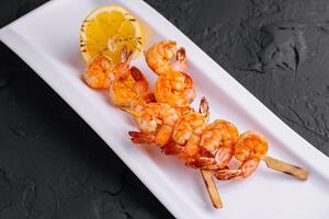 Grilled Shrimp Scampi Skewers with lemon photo