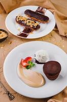 lava cake with ice cream and chocolate eclairs photo