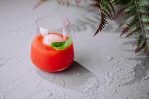 Glasses of fresh tomato juice photo