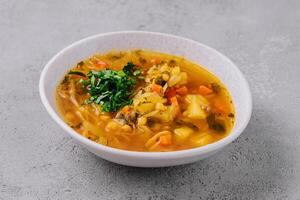 Vegetable soup on stone, top view photo