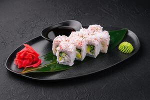 sushi rolls with crab sticks with avocado photo