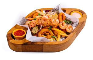 fried seafood plate on wooden tray photo