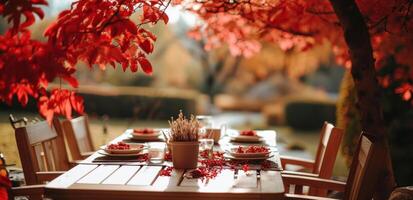 ai generado un mesa conjunto debajo rojo hojas en el jardín foto