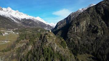 Aerial view of the medieval tower Tornalla Aosta Valley Italy panoramic view with rotation video