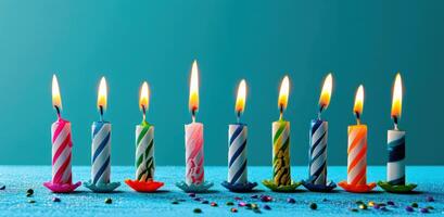 AI generated a row of burning birthday candles lined up on a blue background photo