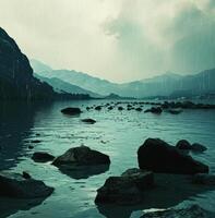 AI generated a lake full of rocks and rocks amidst mountains and rain photo