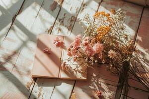 ai generado un de madera mesa con flores y un libro foto