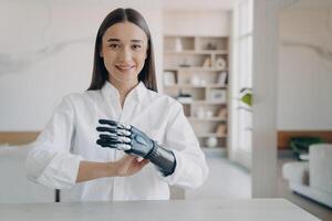 Confident young woman showcasing her bionic arm, embodying the seamless blend of technology and human resilience photo