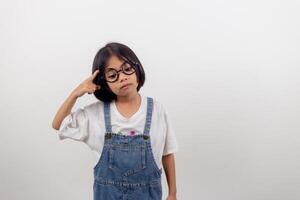 funny Asian child girl wearing glasses on a white background photo