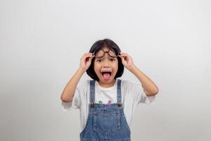 funny Asian child girl wearing glasses on a white background photo