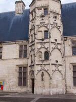 a large building with a clock tower photo