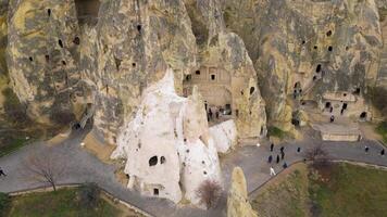 View of the Goreme Open Air Museum in Cappadocia, Turkey. This Unesco World Heritage site is an essential stop on any Cappadocian itinerary. Tourists visiting the historical site. video