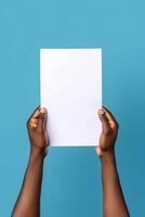 AI generated african american hands holding blank sheet of paper on blue background, neural network generated photorealistic image photo